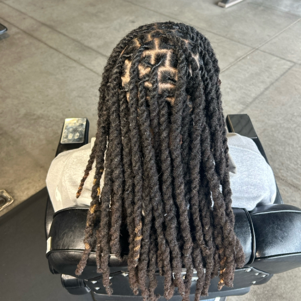 Dreadlock Retwist Half Head at KenzKuts in Eau Claire, WI