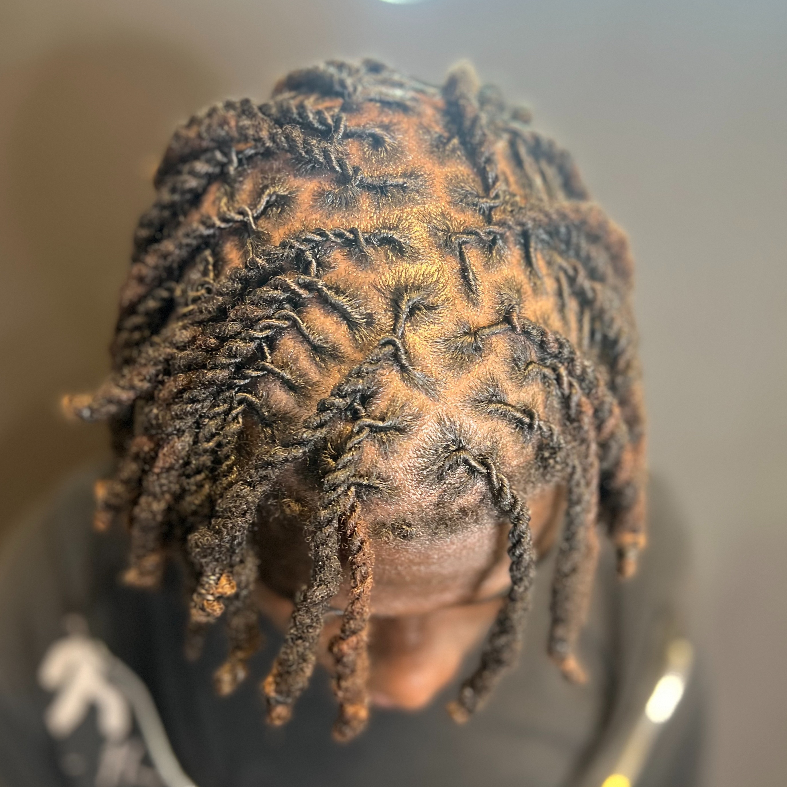 Retwist + 2 or 3 Strand Twists at Mutha Lovin Locs in College Park, GA