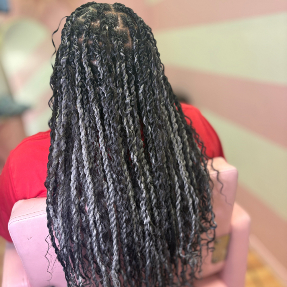 Medium Twist (Weave Added) at Crowned Beauty Studios LLC in Detroit, MI