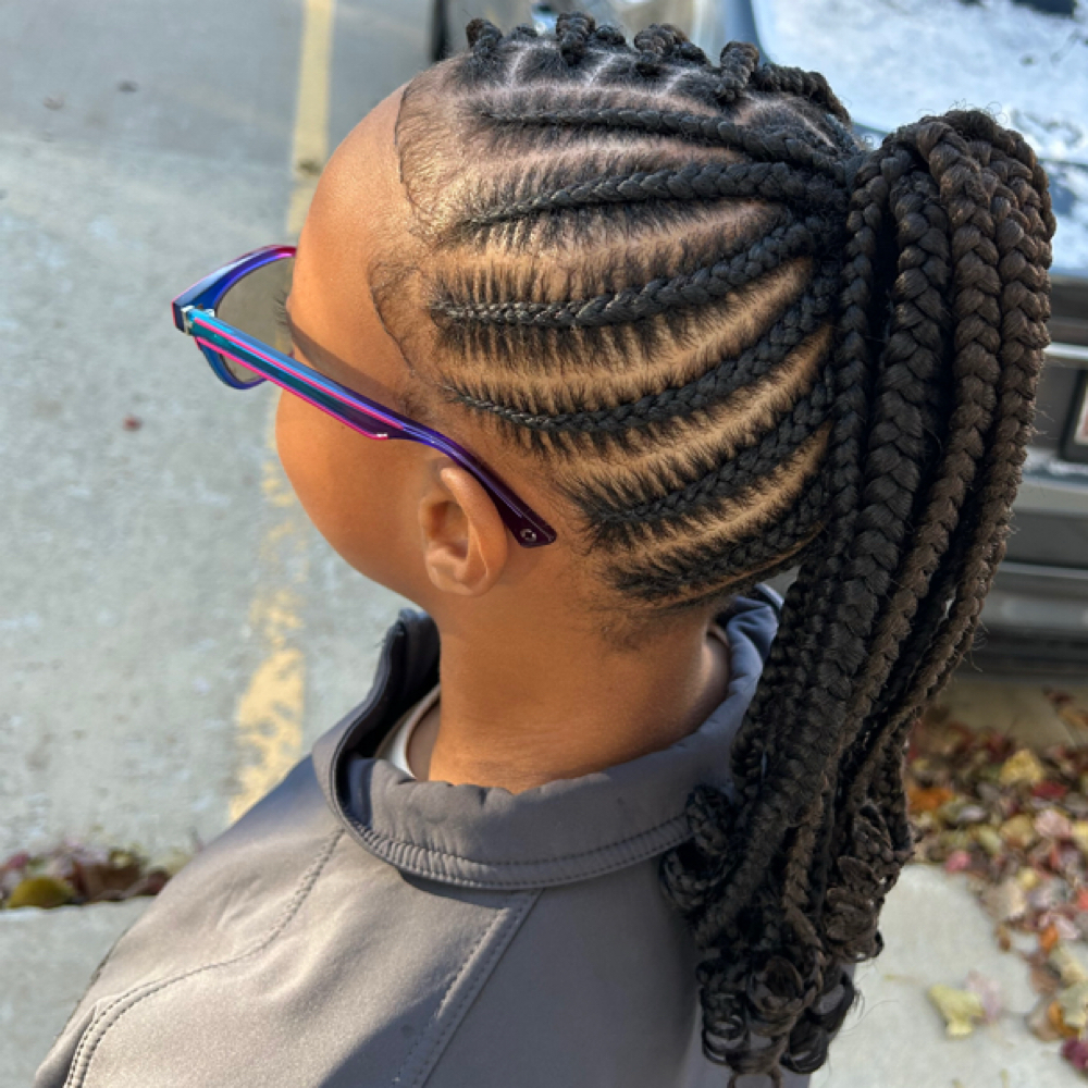 Braided feed-in ponytail at Locs O’ Luv by Nola in Bloomington, IL