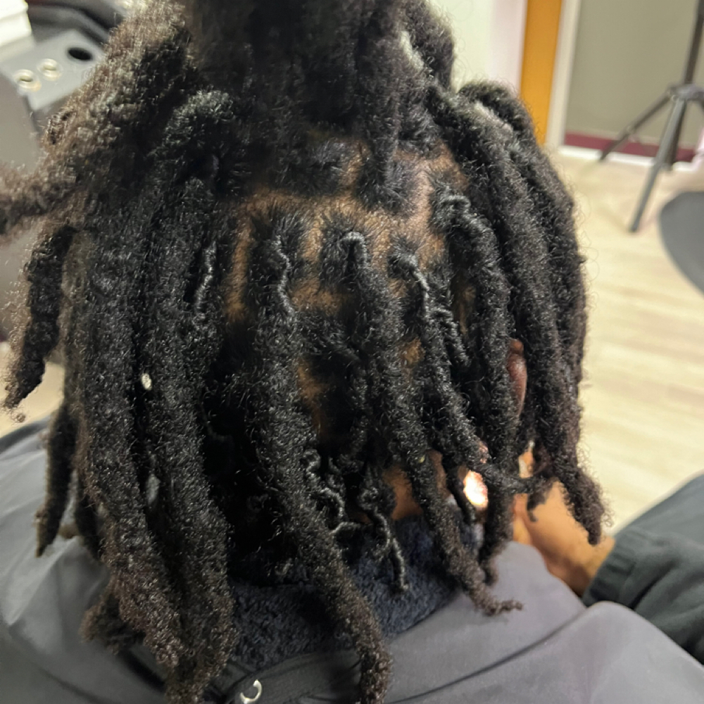 Traditional Loc Retwist at Curly Roots Natural Hair Spa in Clarksville, TN