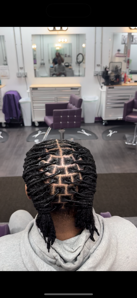 Under 80 Loc Retwist at Lee The Hair Magician LLC in Detroit, MI