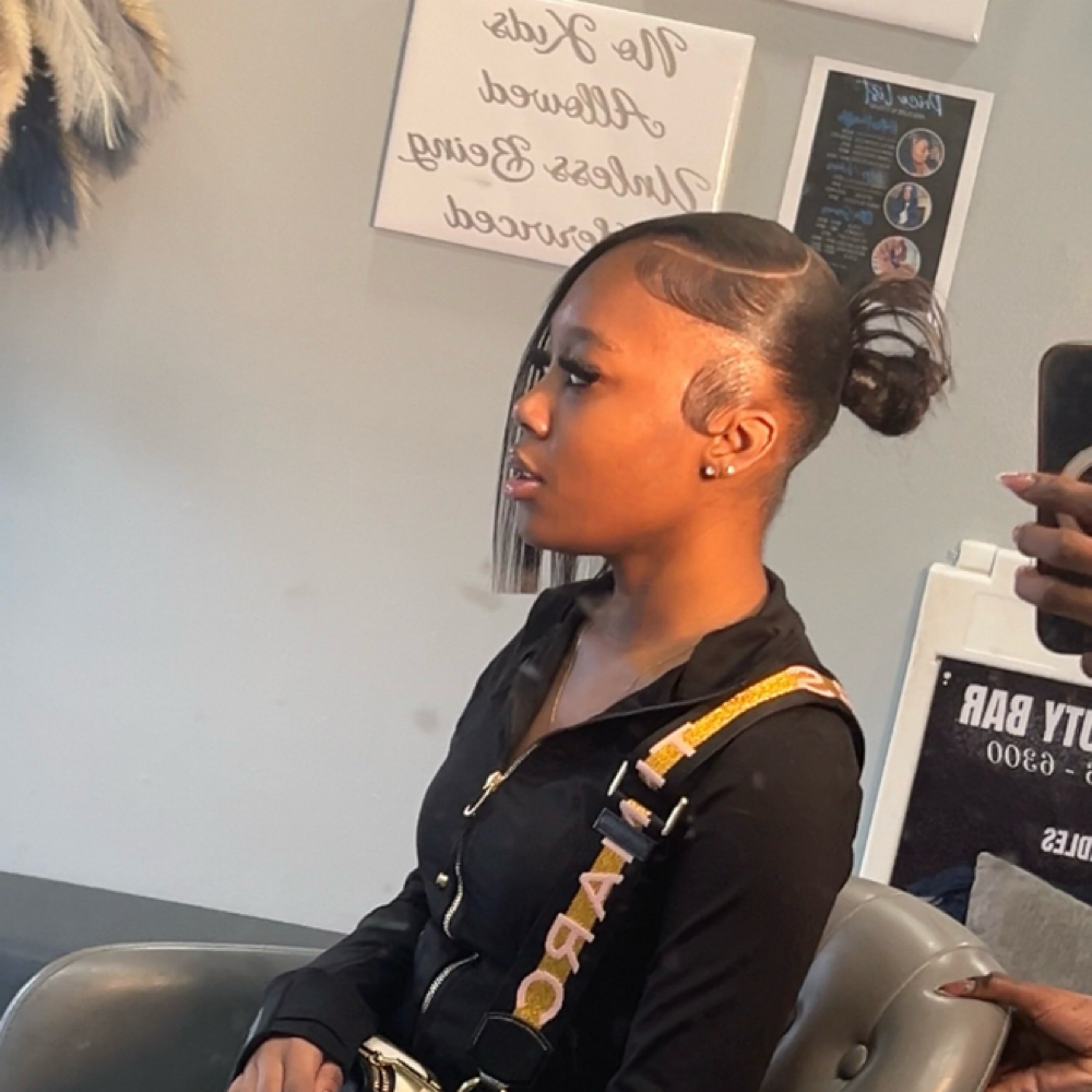 Low Bun With Side Bang / Swoop at Gigi.hair boutique in Bronx, NY