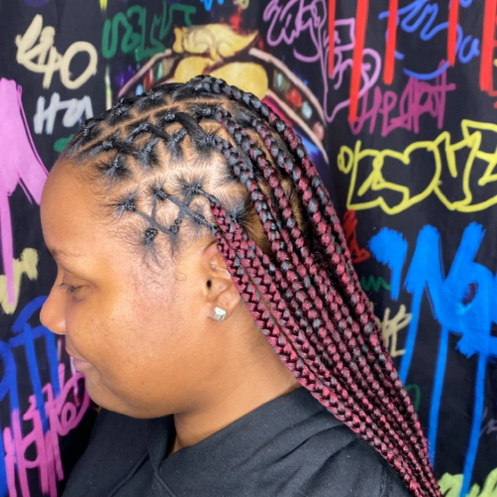 Half rubber band half knotless box at Locs O’ Luv by Nola in Bloomington, IL