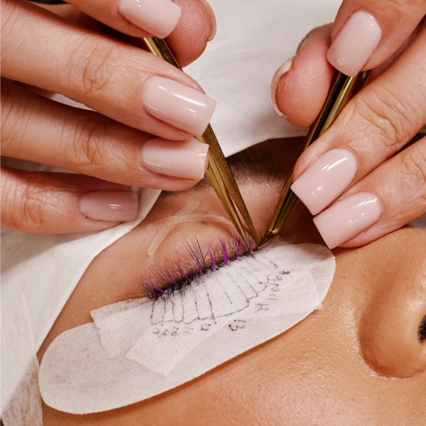 Student Practicing Lashes On Model at All in one beauti and Training studio in Brooklyn, NY