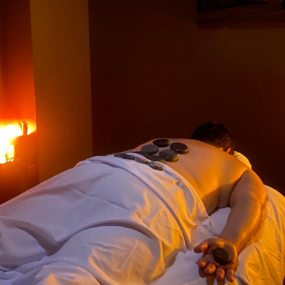 Hot Stone Massage at Massage Flo by Chelsea Johnson in Littleton, CO