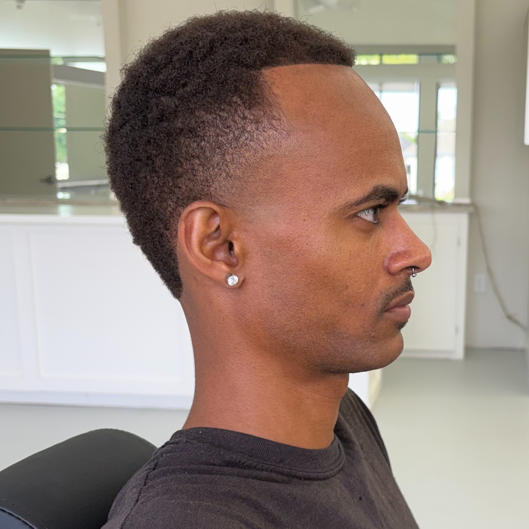 Skin Fade / Specialty Fade at Helena Braiding & Barber Lounge in Houston, TX