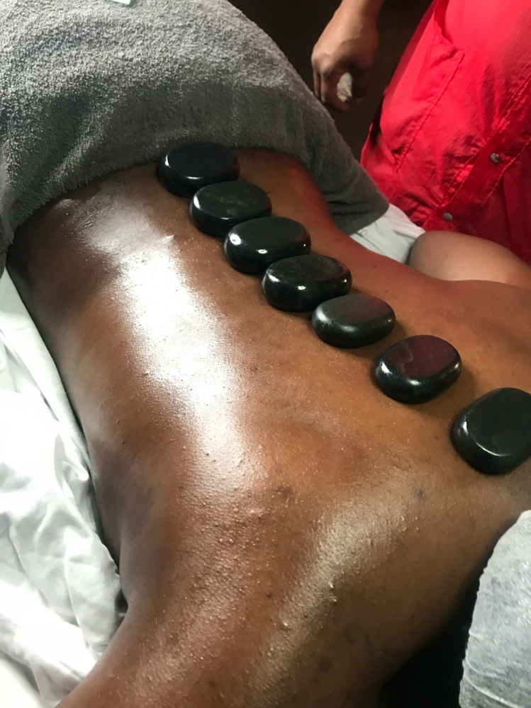 Hot Stone Back Facial at Eximius Bella in Garner, NC