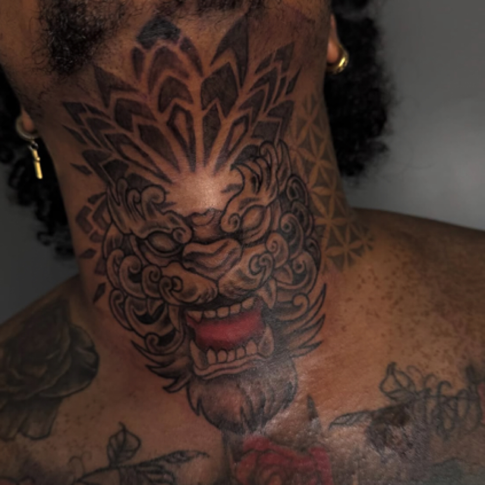 Full neck tattoo at Rilla Tatted it in fayetteville, NC