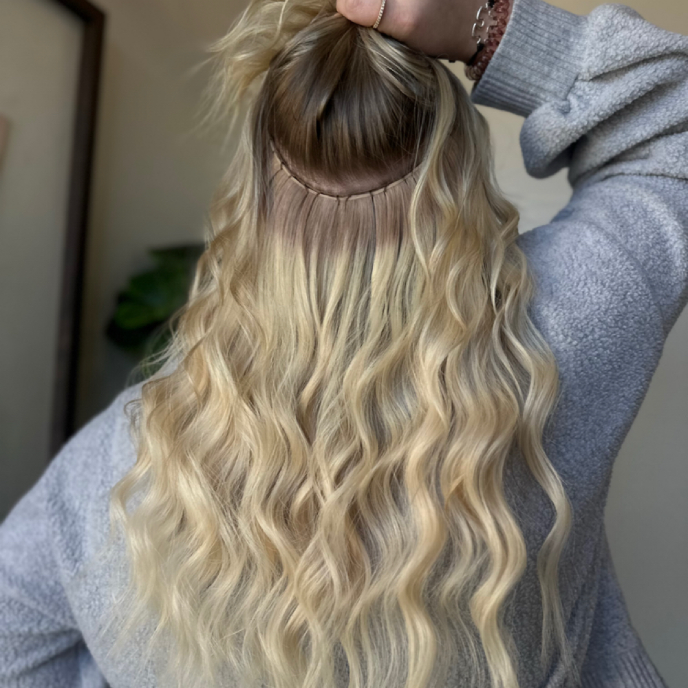 Hair extension 1 row move up at Salon Sylvia in Franklin, WI