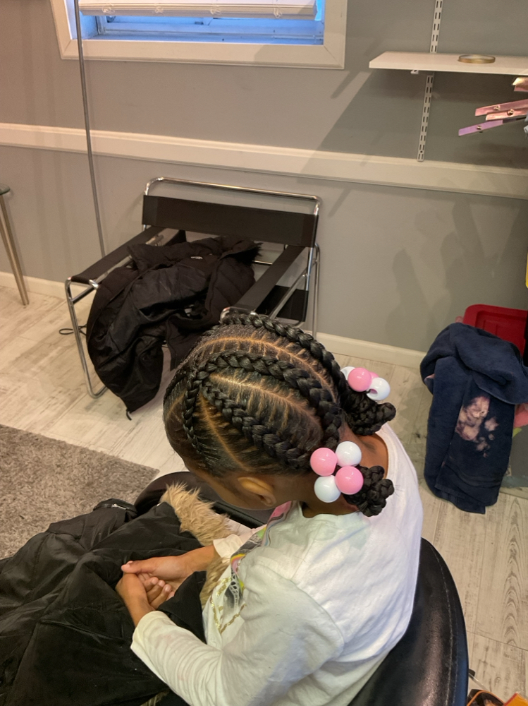 kids 4 criss cross braids w buns at The Hairapist Experience in Mount morris, MI
