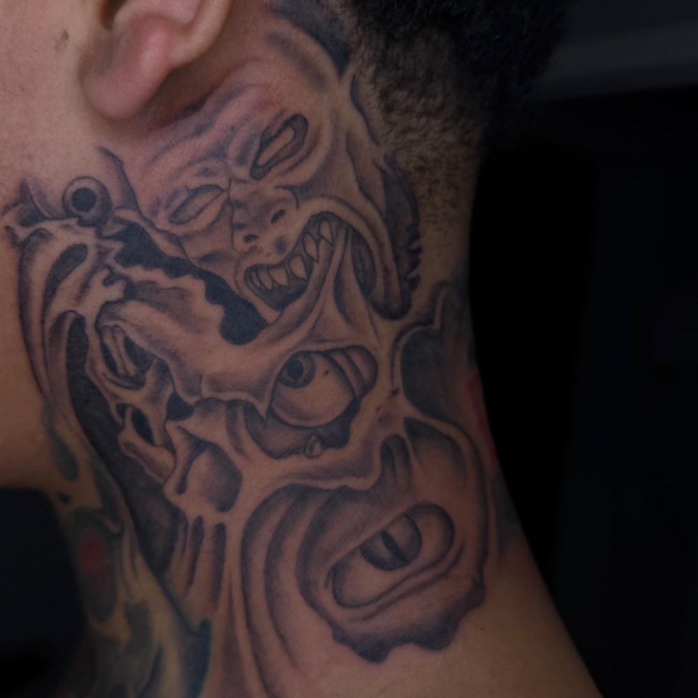 Neck tattoo (one side) at Rilla Tatted it in fayetteville, NC