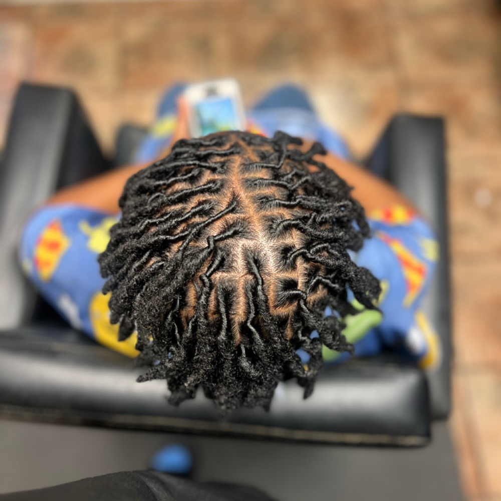 Kids 6-10 Loc Retwist at Elegance Redefined in Belden, MS