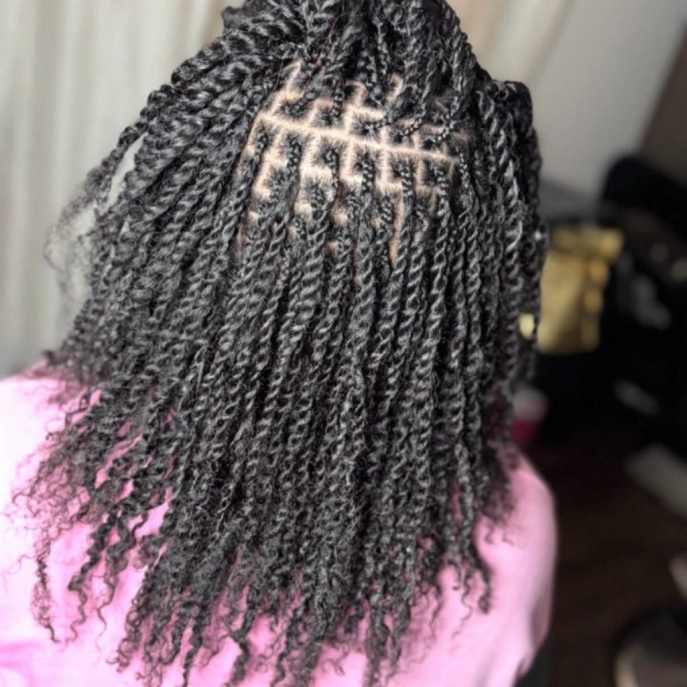 Small 2 twist (with weave) at Meraki Hairstudio 54 in Spring, TX