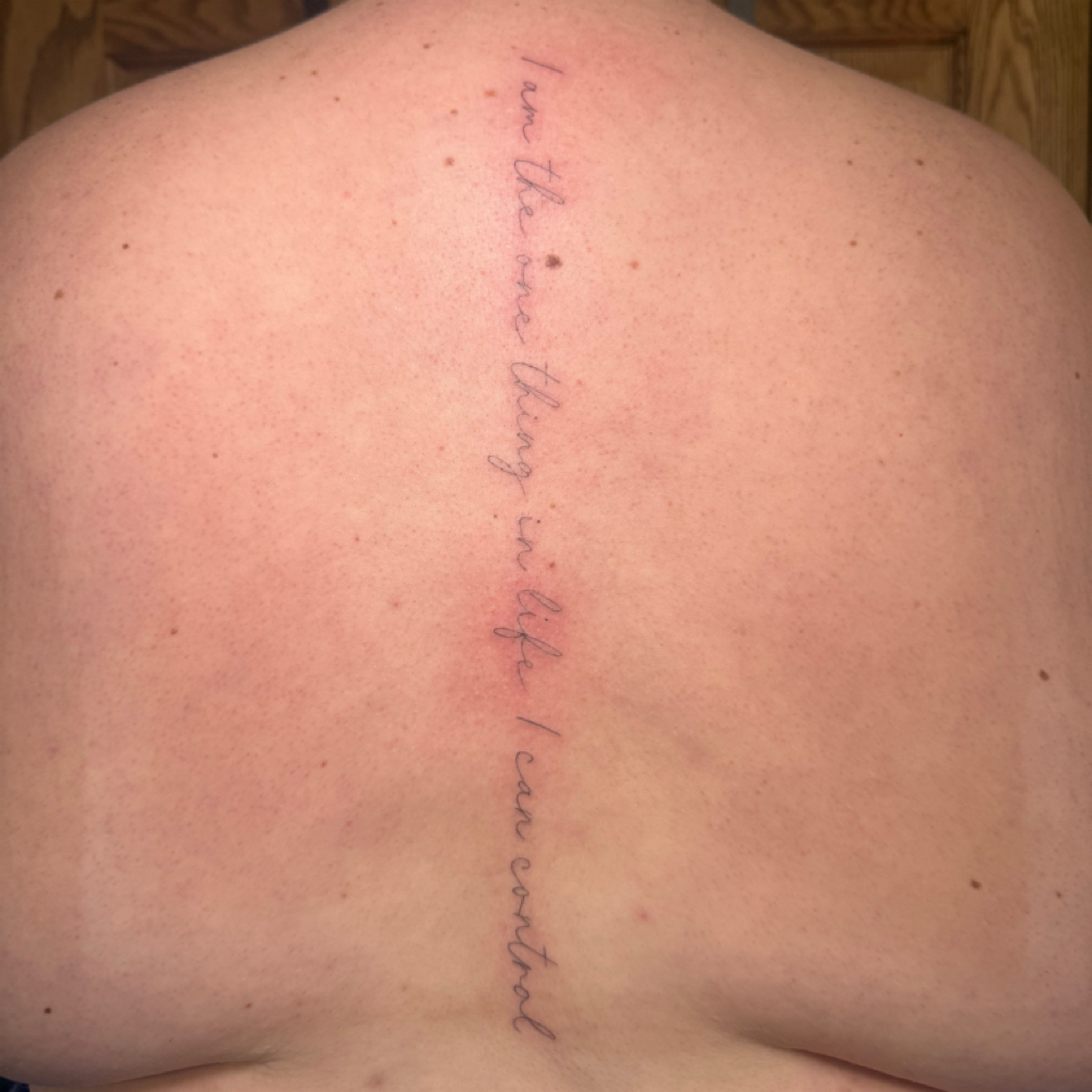 Script Spine Fine Line Tattoo at La Bella Salon in Minford, OH