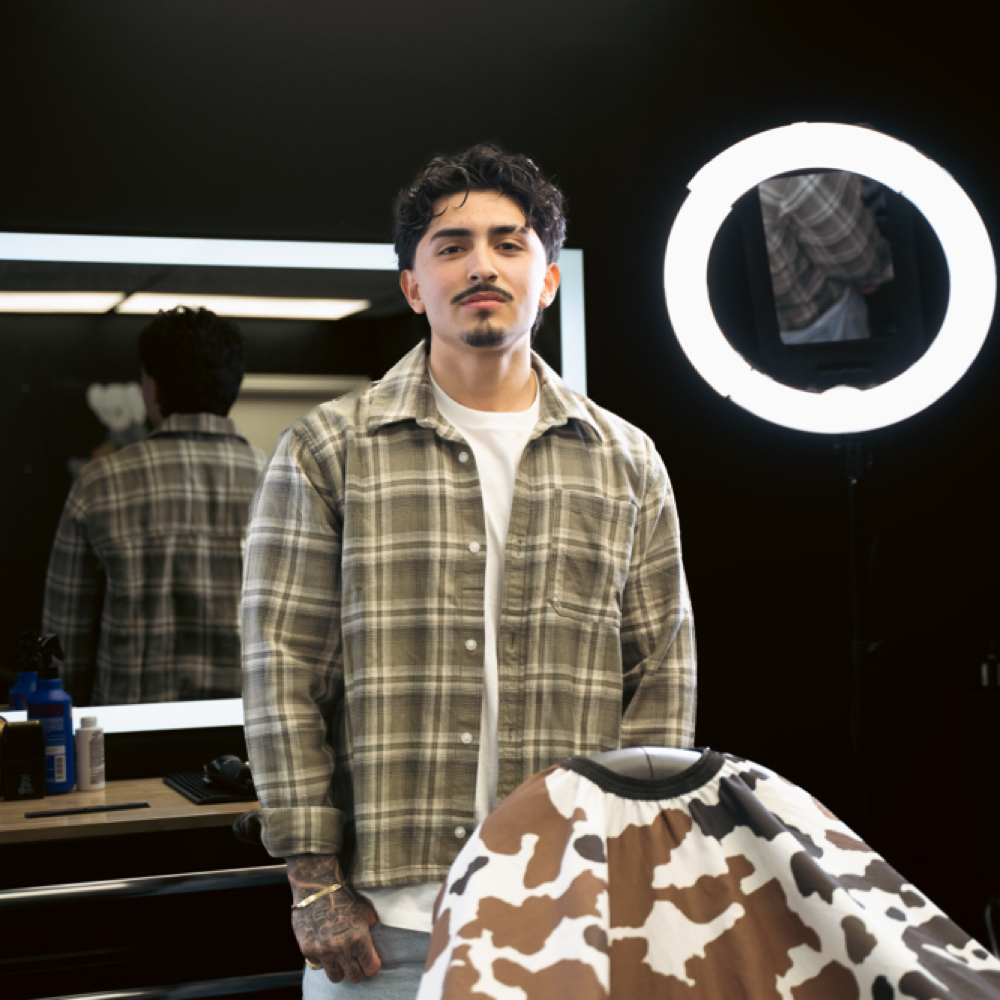 Josue Flores at Deluxe Barber Lounge in Midvale, UT