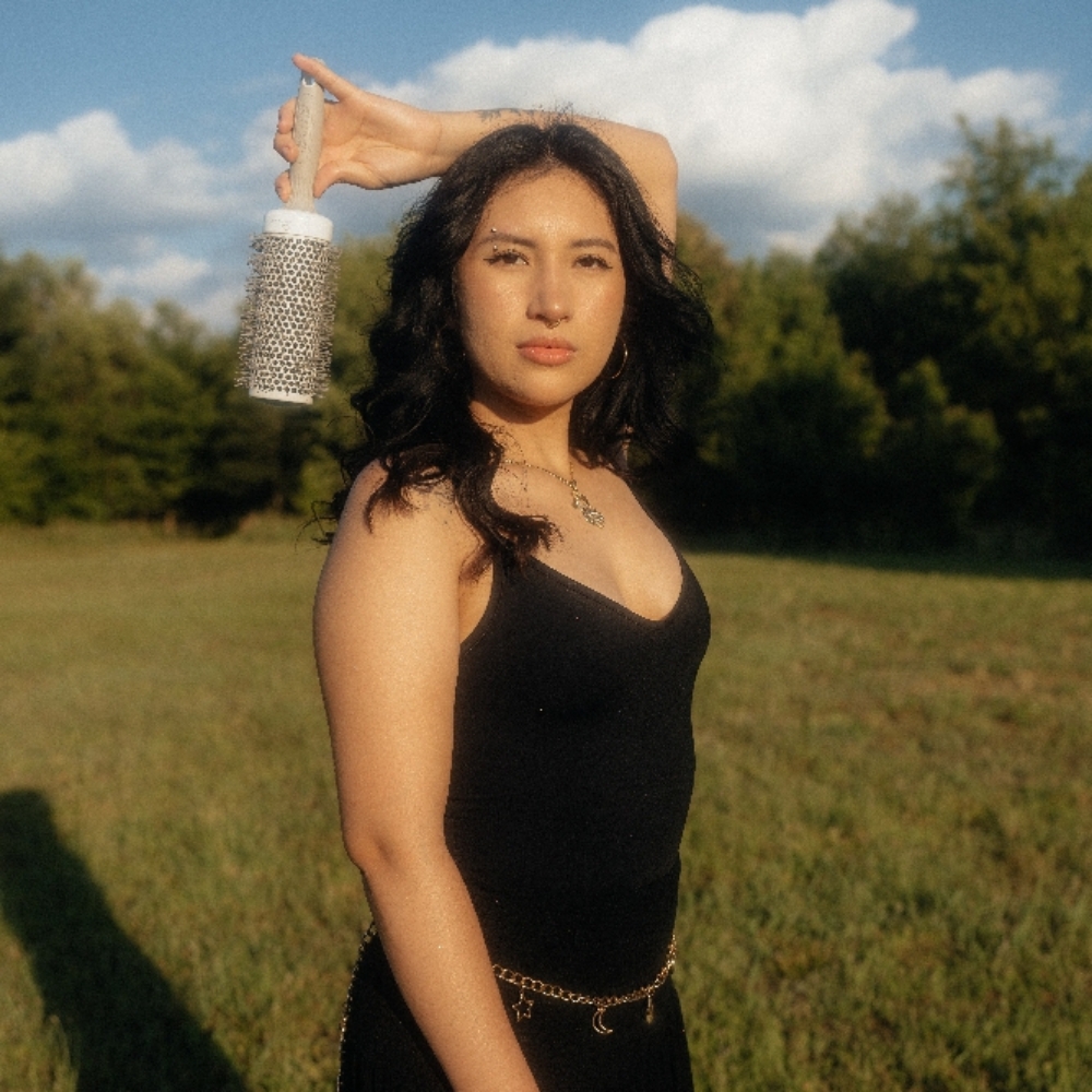 Melissa Manzo at Hairapy Collective LLC in Pasadena, MD