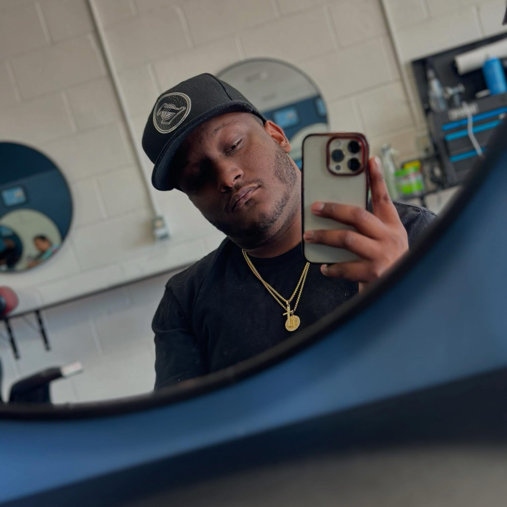 Wayne Robinzine at Swang N Fade Barbershop in Houston, TX