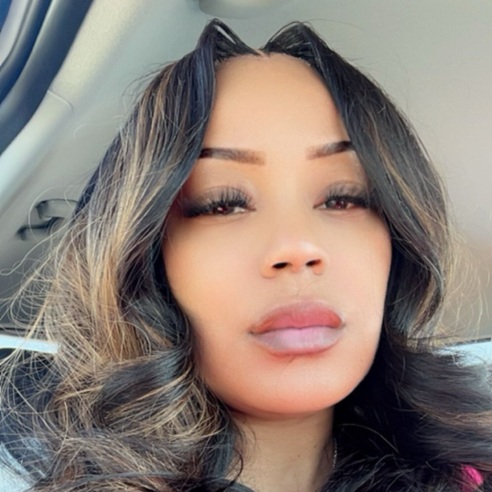 Mz. Magnificent at MAGNIFICENT TOUCH SALON+ barbershop in Canton, OH