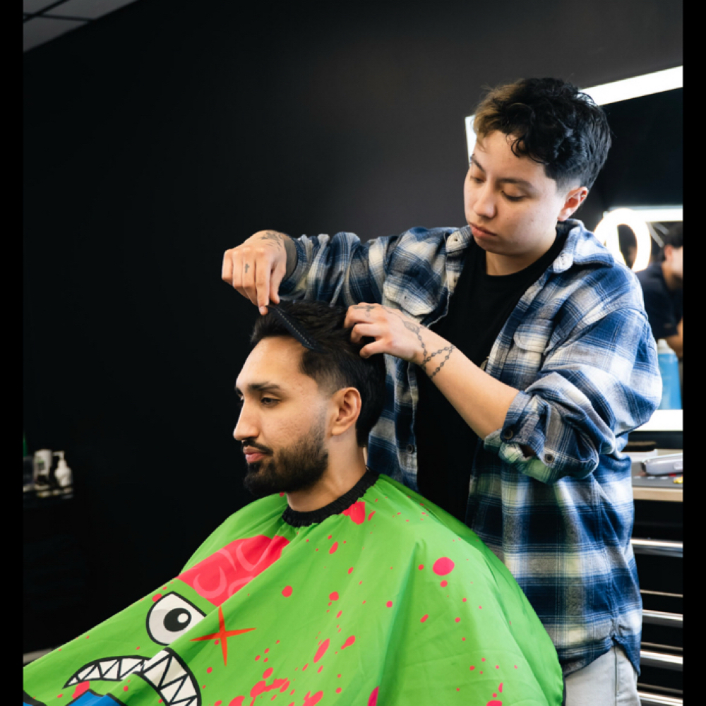 Jamy S at Deluxe Barber Lounge in Midvale, UT